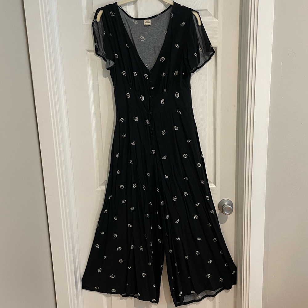 O’Neill black floral button-front jumpsuit with flutter sleeves